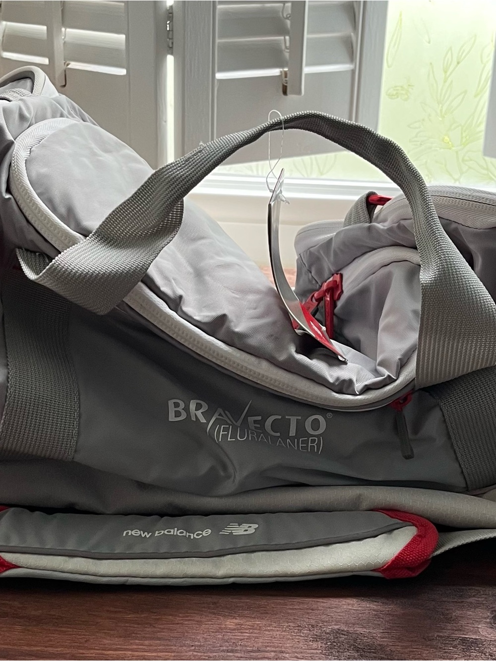 New Balance Gray Duffel Bag with Red Accents - BraveCTO Logo